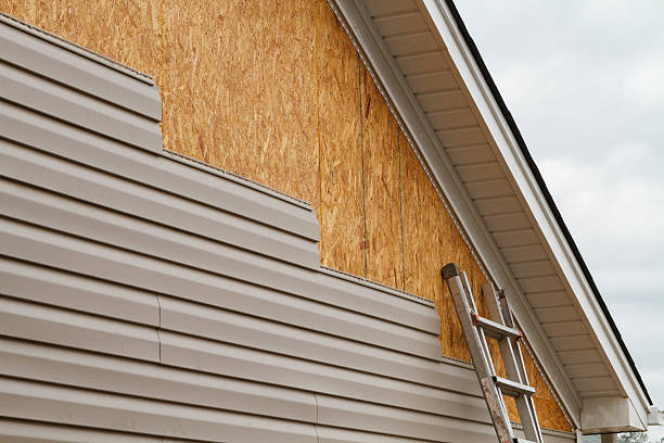 Professional Siding Installation technician working in Longboat Key, FL